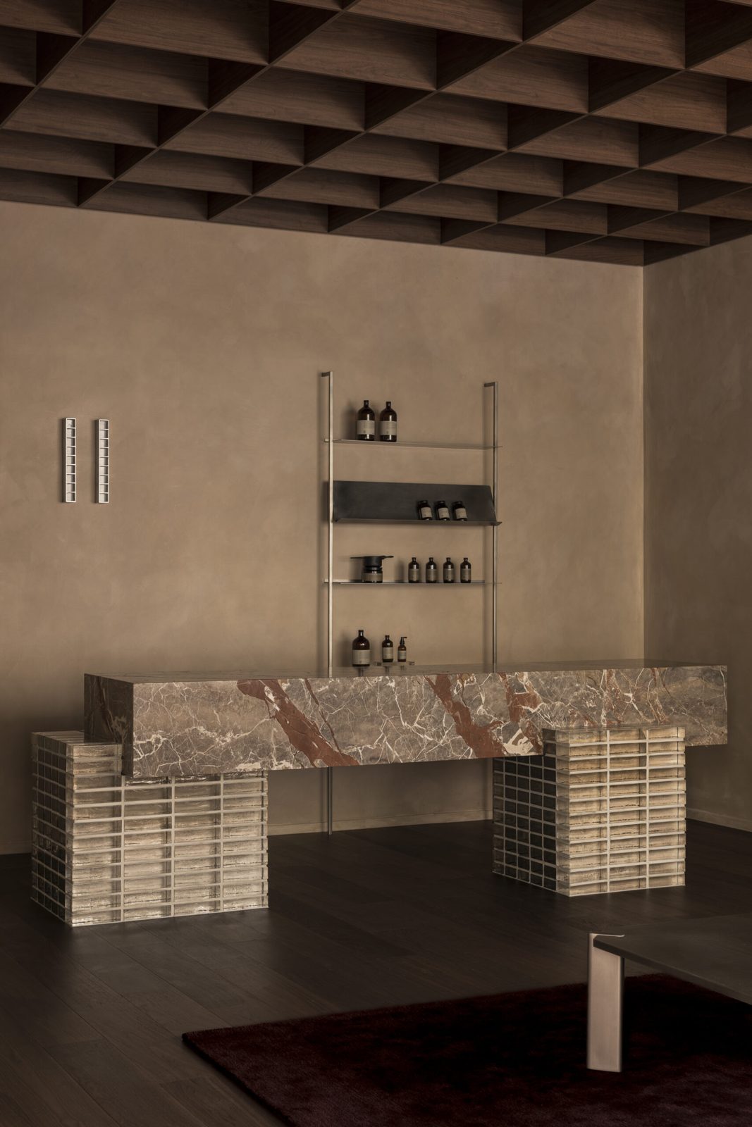 Sculptural Baccaro-stone reception in glass brick and steel